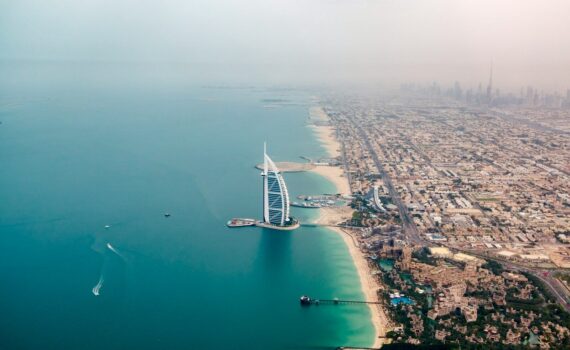 an aerial view of the burj al arab in the middle of the ocean